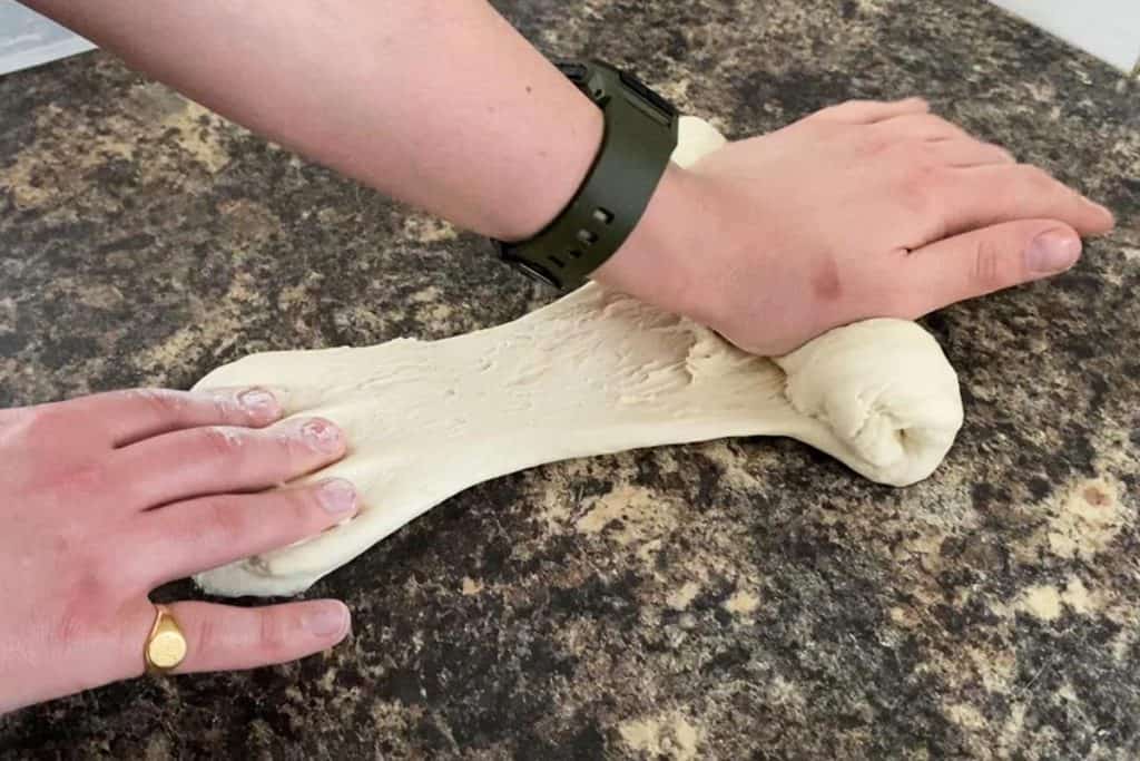 Kneading pizza dough by hand