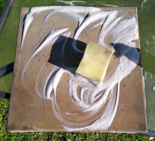 Scrubbing an ooni pizza stone
