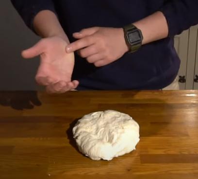 Kneading New York pizza dough