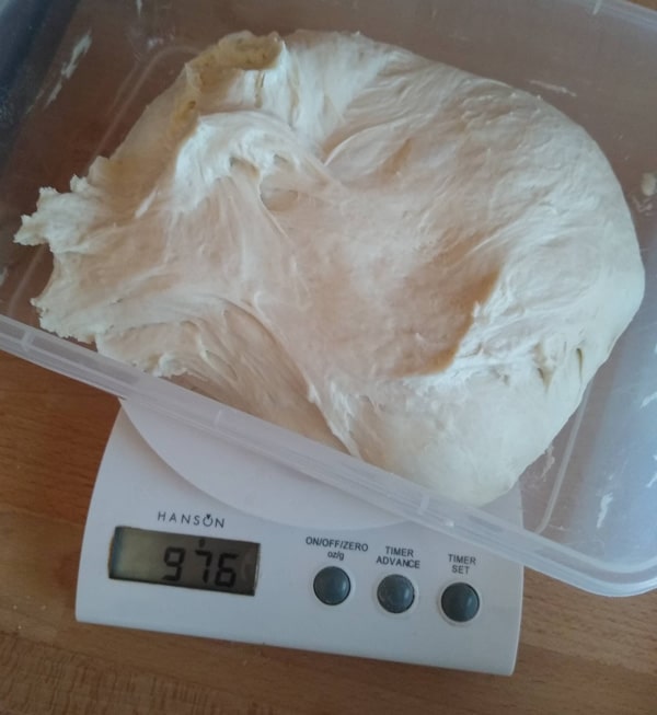 Weighing pizza dough