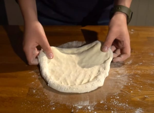 Stretching NYC dough carefully