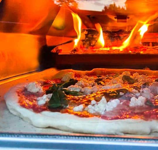 Sourdough pizza cooking in Ooni