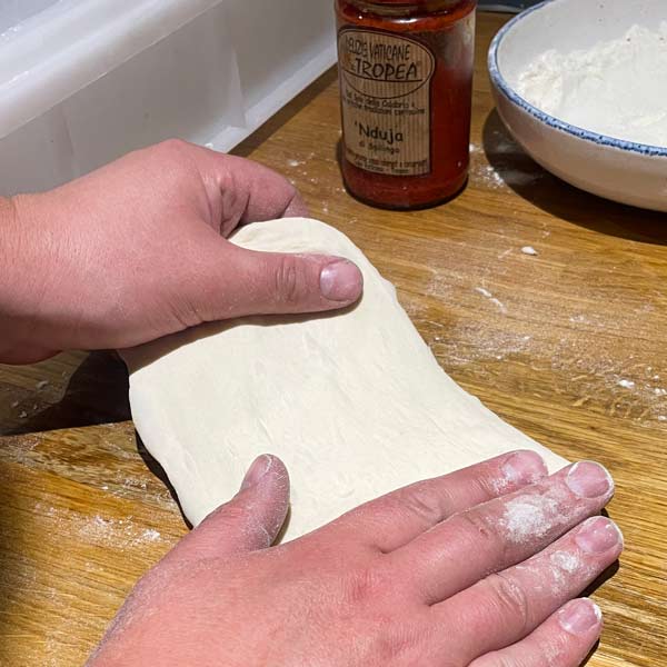 Shaping fried pizza